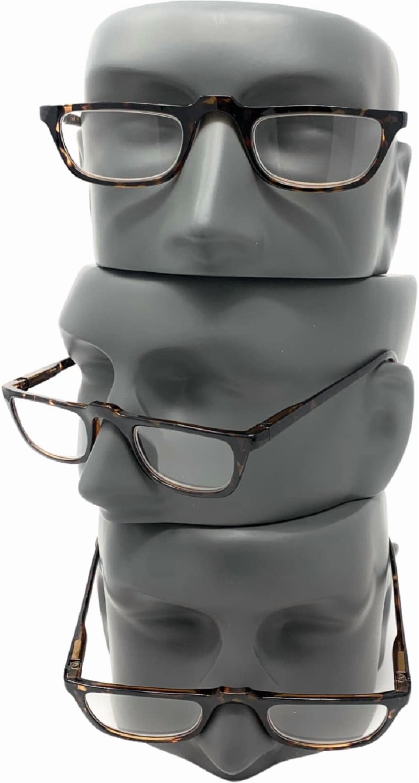 Three stacked gray mannequin heads wearing different pairs of eyeglasses with tortoiseshell frames and clear lenses, set against a plain white background.