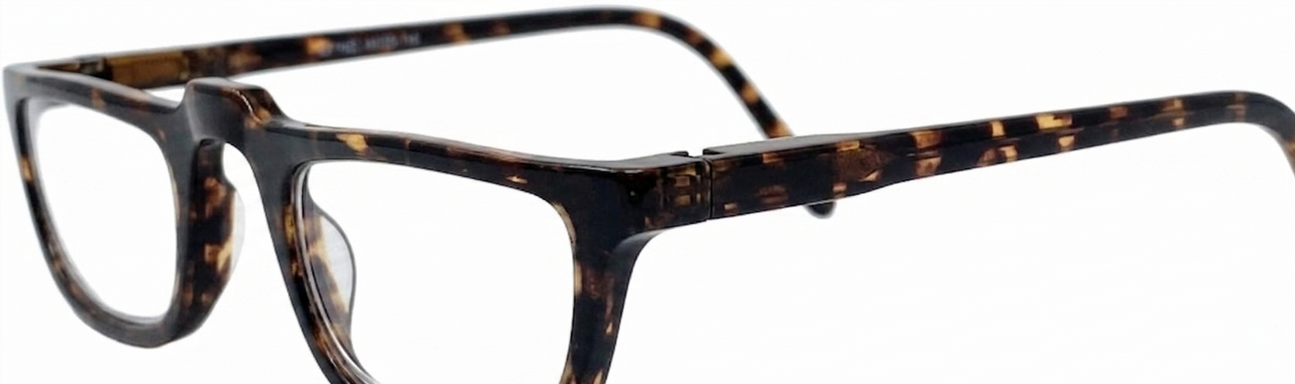 Close-up of a pair of eyeglasses with a dark tortoiseshell frame, featuring a dark brown and black mottled pattern with warm amber-brown spots, on a plain white background.
