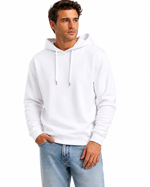 A man wearing a plain white pullover hoodie with white drawstrings and light blue jeans, standing against a solid white background.