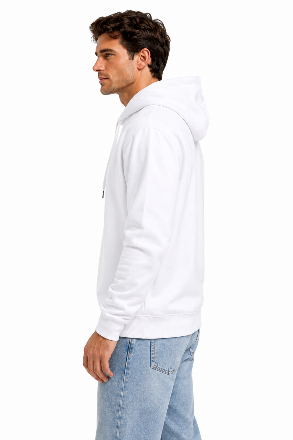 A man in profile wearing a plain white pullover hoodie and light blue jeans, standing against a solid white background.