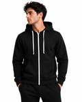 A man wearing a black zip-up hoodie with white drawstrings and a white front zipper, paired with black sweatpants, photographed against a plain white background.